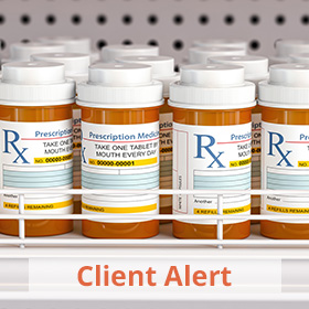 A row of pill bottles on a shelf with the words Client Alert written below.